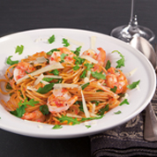 Peperoniwürzige Spaghetti mit Riesengarnelen und Rucola